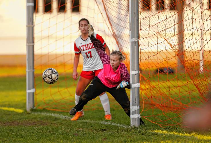 Athol goalkeeper Ava Adams eyes in the ball for a save against Smith Vocational in the second half Friday in Northampton.