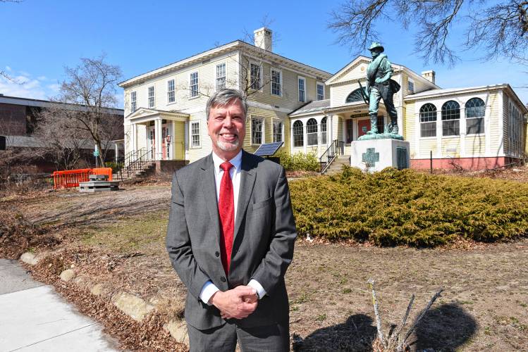 Thomas Meshako, president and CEO of Greenfield Savings Bank, in front of the Leavitt-Hovey House, former home of the Greenfield Public Library. The bank officially gained ownership of the building on Wednesday.