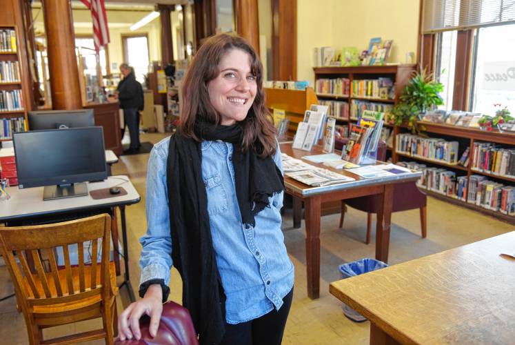 Montague Public Libraries Director Caitlin Kelley, pictured in Carnegie Public Library in Turners Falls. 