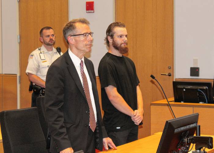 Brendon L. Douglas, right, 21, of Hooksett, New Hampshire, stands in Franklin County Superior Court on Wednesday afternoon next to defense attorney Stephen Shea.