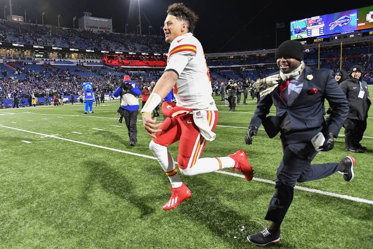 Chiefs quarterback Patrick Mahomes (15) reacts after defeating the Bills in an AFC divisional playoff game, Sunday in Orchard Park, N.Y.