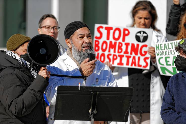 Neurologist Dr. Mohammad Ali Hazratji speaks while dozens of area health care workers rally outside U.S. District Court in Springfield on Tuesday to demand that Congressman Richard Neal join their call for an immediate cease-fire in Gaza.