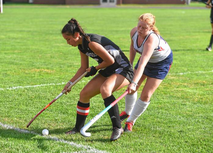 Frontier’s Abbi Glover, right, defends Longmeadow’s Mia Santiago during Suburban League action on Tuesday in South Deerfield.