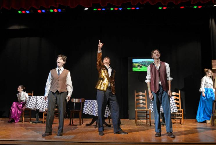 Leila Bosman, as Albert Einstein, Malcolm Howard as “The Visitor” and Mason Smith as Pablo Picasso in a scene from Frontier Regional School’s production of “Picasso at the Lapin Agile.”