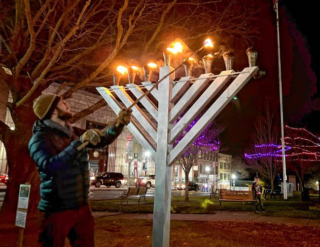 The community gathered on the Greenfield Common on Wednesday night to light the menorah at the first-ever illumination ceremony on the seventh night of Hanukkah.