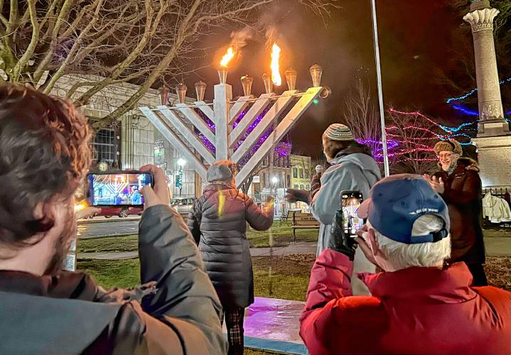 The community gathered on the Greenfield Common on Wednesday night to light the menorah at the first-ever illumination ceremony on the seventh night of Hanukkah.