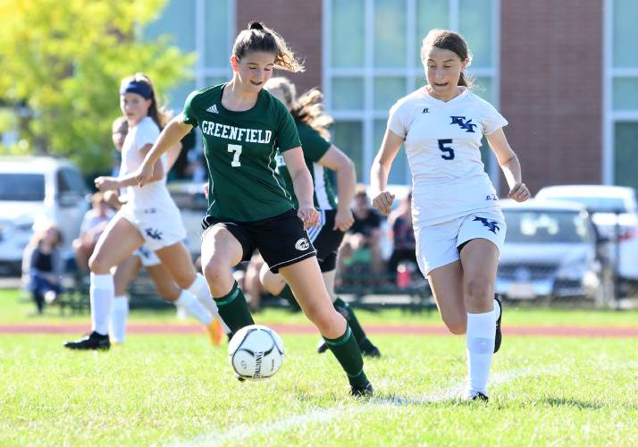 Greenfield’s Carly Blanchard (7), left, and Franklin Tech’s Anne Kolodziej (5) battle for the ball in Greenfield last season. 