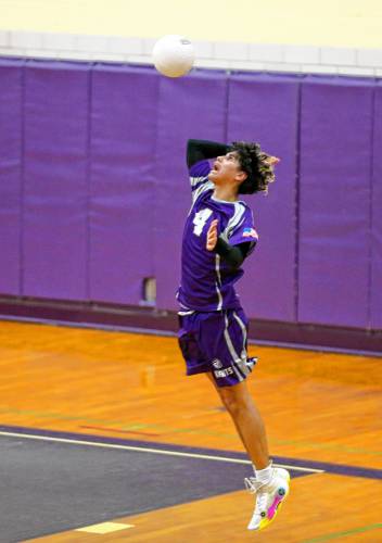 Holyoke’s Adrian Centeno-Feliciano (4) serves the ball in the second set against Athol on Friday in Holyoke.