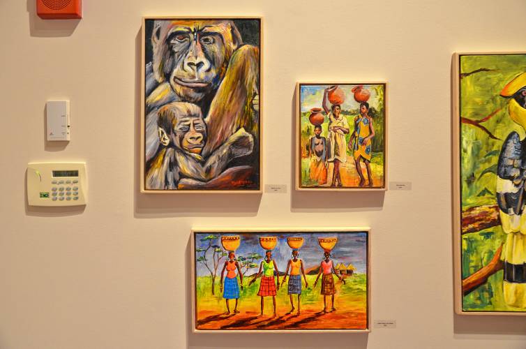 Paintings by Mwanga William on display at Northfield Mount Hermon school.