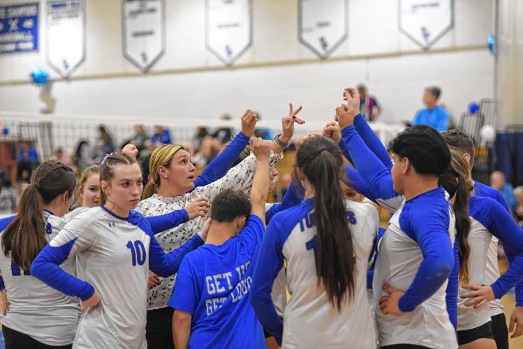 The Turners volleyball team huddles around coach Kelly Liimatainen on Monday during a match against West Springfield in Turners. 