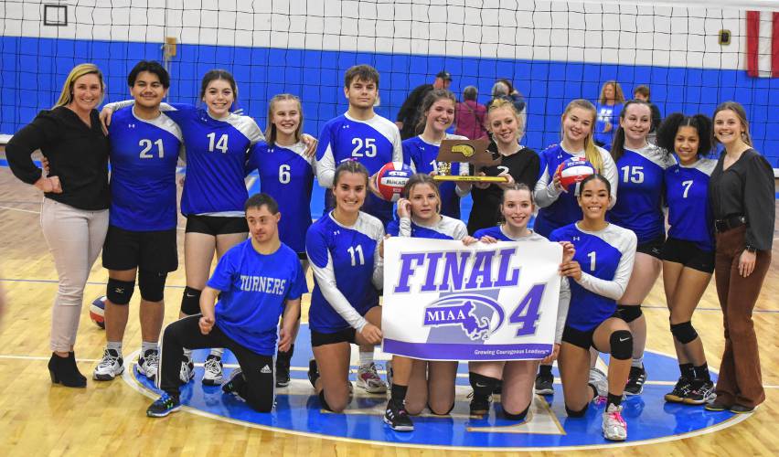 The Turners Falls volleyball team shows off its new Final Four banner following a 3-0 sweep of Hopedale in the MIAA Division 5 quarterfinal round on Thursday in Turners Falls.
