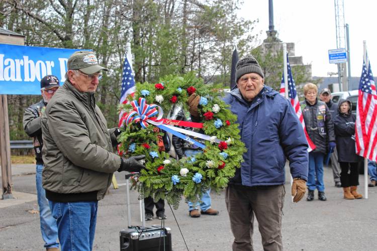 Veterans at the annual Pearl Harbor Remembrance Day ceremony on Thursday in Gill with a wreath to be displayed.