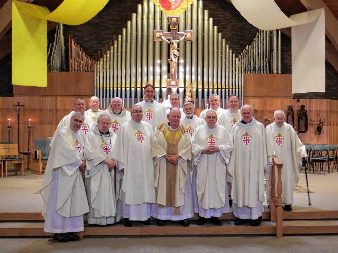 Several deacons and fellow priests visited Blessed Sacrament Church in Greenfield on April 6 for a Mass celebrated by the Rev. Timothy Campoli, front row, center, on the 50th anniversary of his ordination of a Catholic priest.