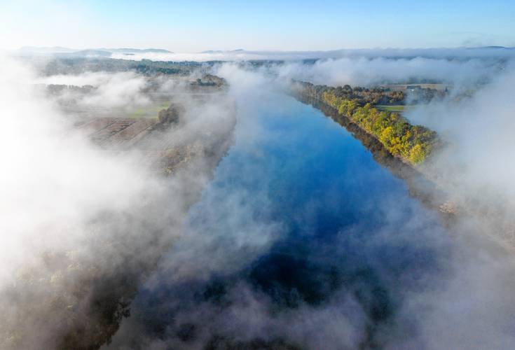 Fog rolls through across the valley over the Connecticut River in the early morning in Sunderland.