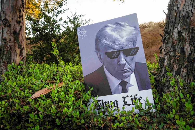 A sign is left behind by Donald Trump supporters after a rally Sept. 27 during the second Republican presidential debate outside the Ronald Reagan Presidential Library in Simi Valley, Calif.