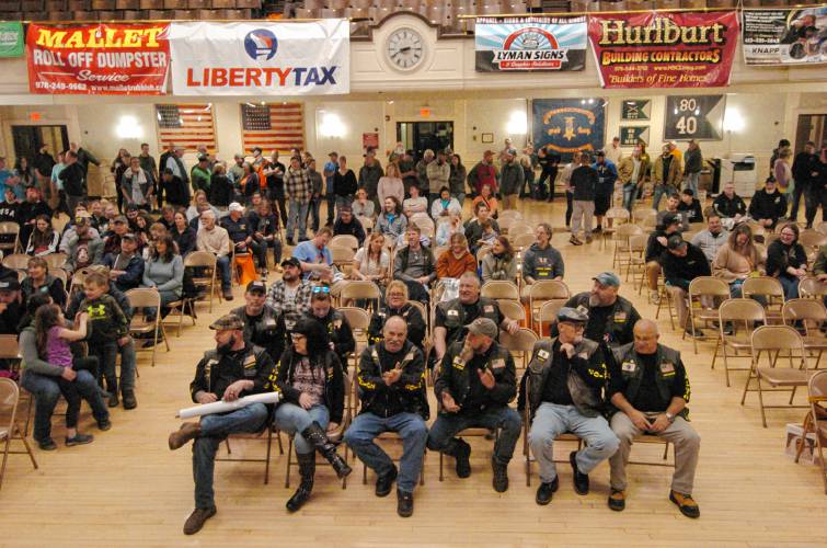 Racers wait to find out their position at the drawing at Athol Town Hall on Friday night before the 59th running of the River Rat Race.