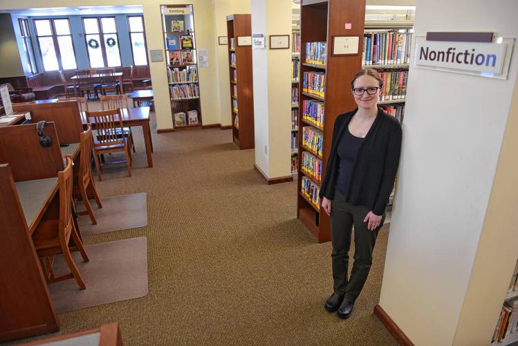 Sunderland Public Library Director Katherine Umstot stands in the main part of the library where the carpet is set to be replaced.