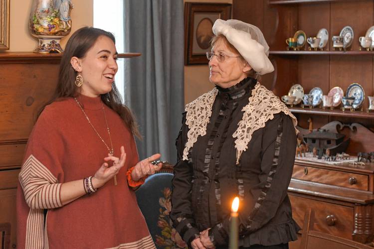 Marisca Pichette, a 2019 graduate of Mount Holyoke College, talks with Mount Holyoke College founder Mary Lyon, played by alumna Katherine McKay, at a birthday luncheon in honor of Lyon in Buckland on  Wednesday.