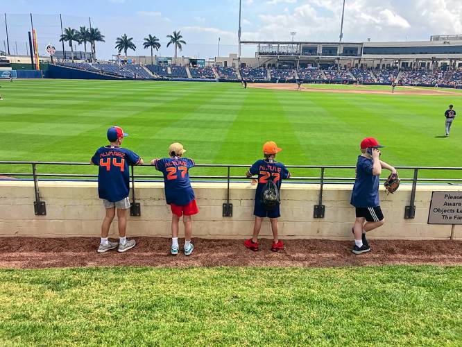 Call to the Bullpen: Youngsters watch the Astros-Nats game at CACTI Ballpark of the Palm Beaches in West Palm Beach, Fla. on March 9.