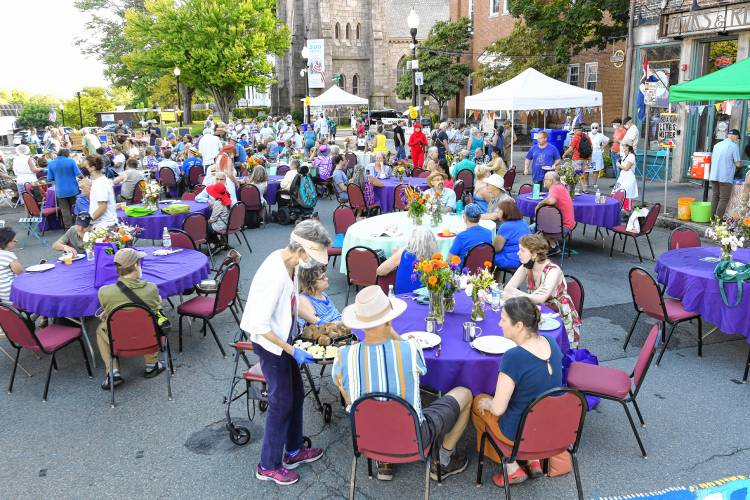 People gather on Court Square for the in-person Harvest Supper organized by the Stone Soup Cafe.