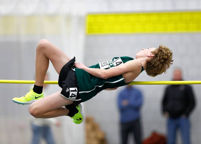 Greenfield’s Mason Youmell competes in the high jump during the PVIAC indoor track meet Wednesday at Smith College in Northampton.