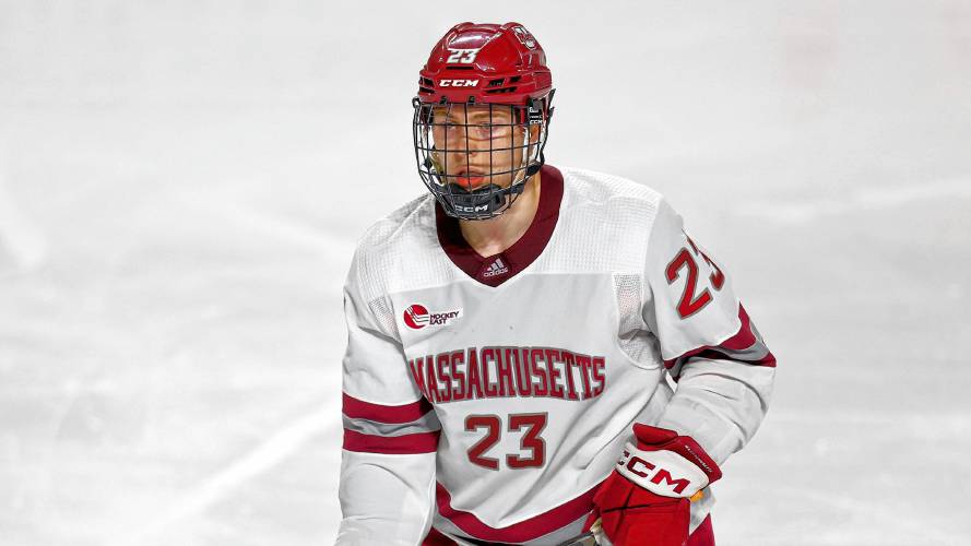 Massachusetts defenseman Scott Morrow (23) skates against Brown last season in Amherst. Morrow and the Minutemen open their 2023-24 campaign Saturday against AIC at the Mullins Center.