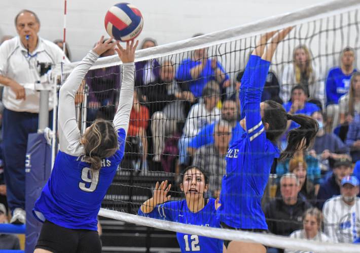 Turners Falls’ Taylor Greene (9), left, battles at the net with Hopedale’s Mia Cote (5) during the second set of the Thunder’s  3-0 sweep of Hopedale in the MIAA Division 5 quarterfinal round on Thursday in Turners Falls.