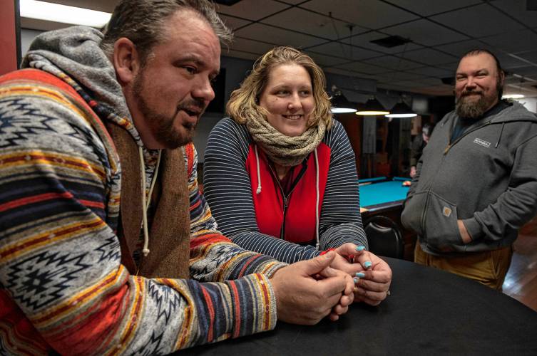 Donald Carberry, a co-sponsor for the arm wrestling event The Pulaski Pull Down, Rose Lynch and Chris Parker at Se7ens Sports Bar and Grill in Easthampton Thursday evening, Dec. 6, 2023.