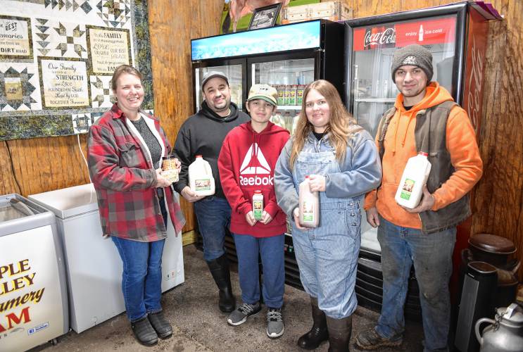 Keri and Brian Peila with their children Ben, 13, Samantha, 18, and Brian, 20, of Gill in their Peila’s Creamery farm store at Sunrise Valley Farm.