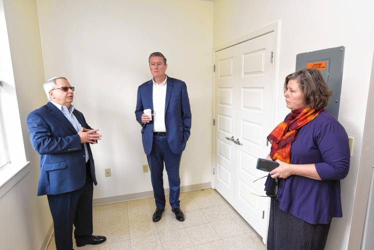 Greenfield Housing Authority Executive Director Thomas Guerino gives a tour of an apartment in the Winslow building to Massachusetts Housing Secretary Edward Augustus and state Sen. Jo Comerford, D-Northampton.