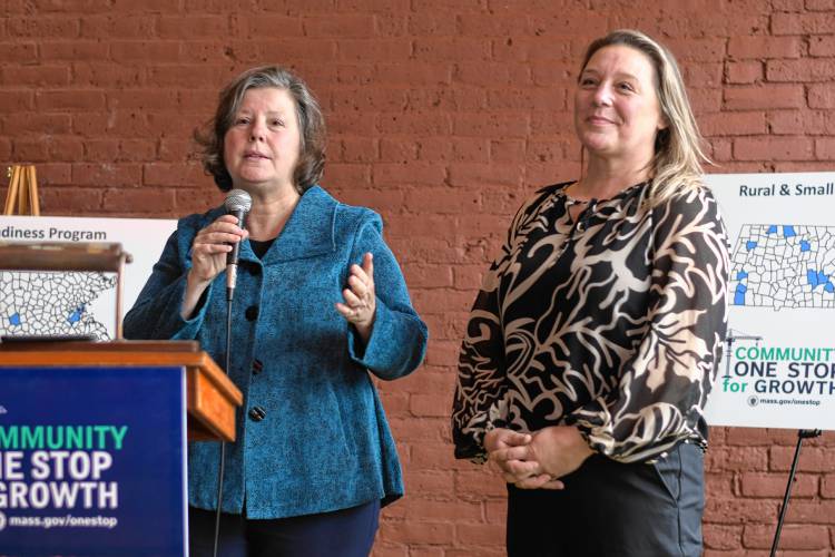 Sen. Jo Comerford and Rep. Natalie Blais speak at the Community One Stop for Growth awards ceremony at the Shea Theater Arts Center in Turners Falls on Tuesday. 