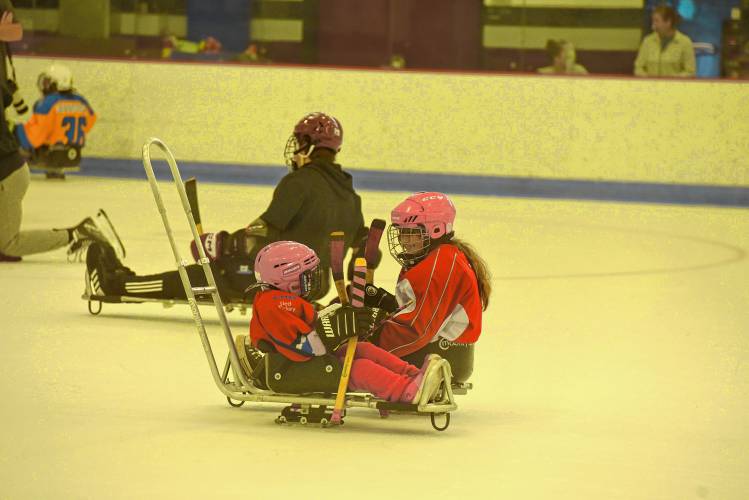 Skaters compete during CHD's All In Sled Hockey Open Skate on Monday at the Mullins Center practice rink in Amherst.