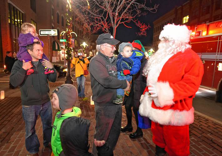 Santa visits with children at a previous Jinglefest in Greenfield.