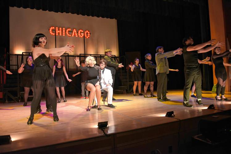 Students involved with the production of the spring musical “Chicago” rehearse a scene in the Turners Falls High School auditorium on Monday.