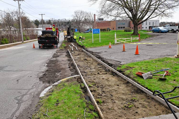 Sidewalks are being replaced on Beacon Street in Greenfield. 