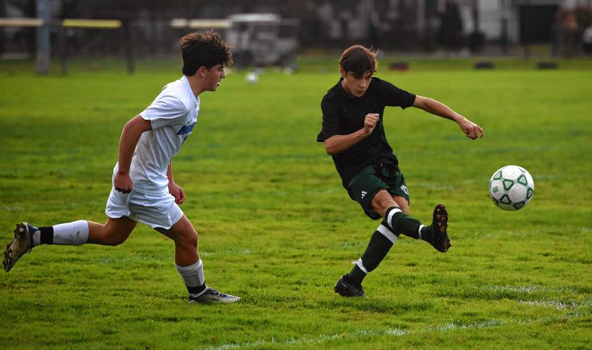 Greenfield’s Max Kovizhnyh, right, clears the ball from his own zone during  the host Green Wave’s 3-0 loss to Monson at Vets Field on Wednesday.