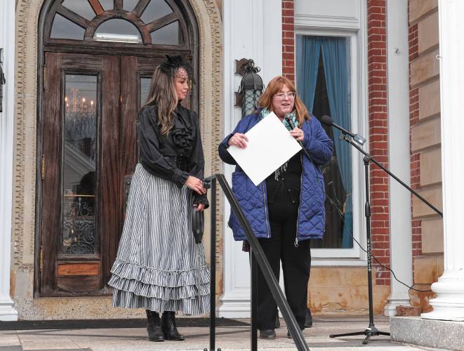 Revival Wheeler Mansion owner Cynthia Butler is given a citation by state Rep. Susannah Whipps, I-Athol, on Monday for her work restoring the historic mansion in Orange and opening it as a bed and breakfast.
