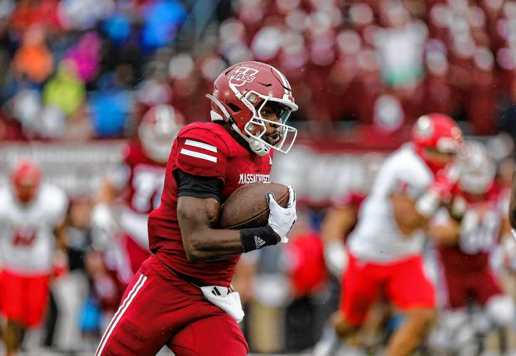 Umass wide receiver Anthony Simpson (8) runs upfield for a first down against New Mexico in the second quarter Saturday at McGuirk Alumni Stadium in Amherst.