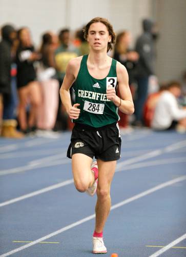 Greenfield’s Jackson Caron runs to a third place finish in the one mile during the PVIAC indoor track meet Wednesday at Smith College in Northampton.
