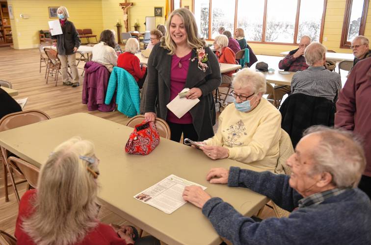 Jennifer Remillard, director of the South County Senior Center, chats with members at the center’s temporary location at the Holy Family Roman Catholic Church’s Pope St. John Paul II Center in 2022. The South County Senior Center, which included Conway’s Council on Aging in its application, received about $120,000 in grant funding from the Executive Office of Elder Affairs.