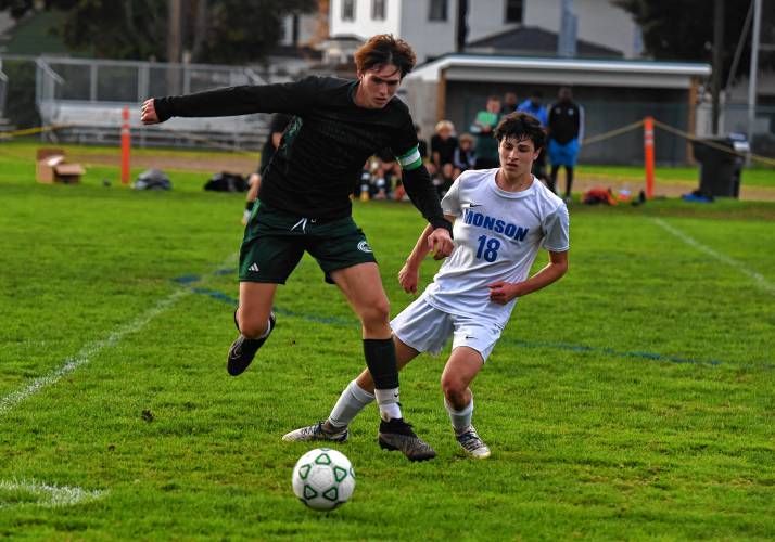 Greenfield’s Jacob Blanchard, left, battles for possession in front of Monson’s Sebastian Nava during the host Green Wave’s 3-0 loss at Vets Field on Wednesday.
