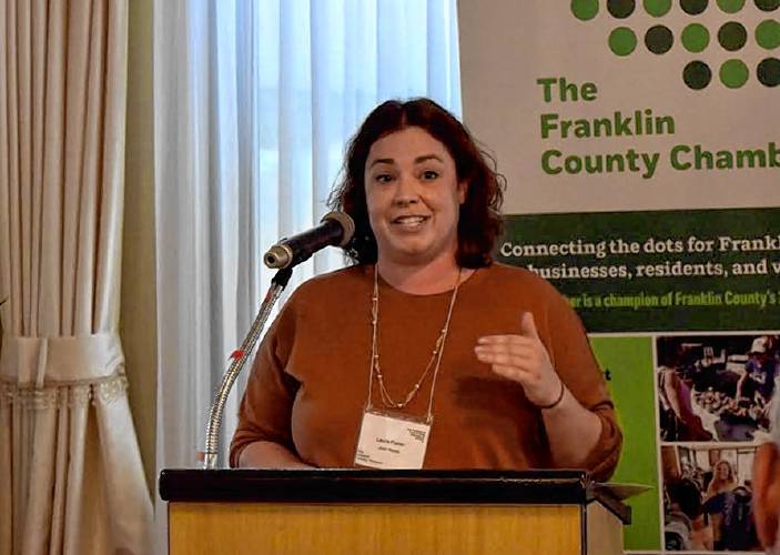 Laura Fisher, Executive Director of Just Roots, speaks at the Franklin County Chamber of Commerce breakfast at the Terrazza restaurant on Friday morning.