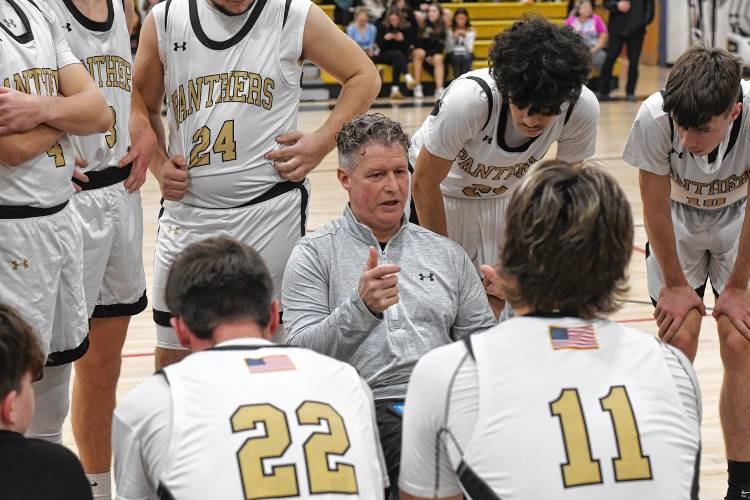Pioneer head coach Scott Thayer talks to his team during a timeout against Turners Falls. The Panthers picked up a 74-26 victory on Tuesday night at Messer Gymnasium in Northfield. 