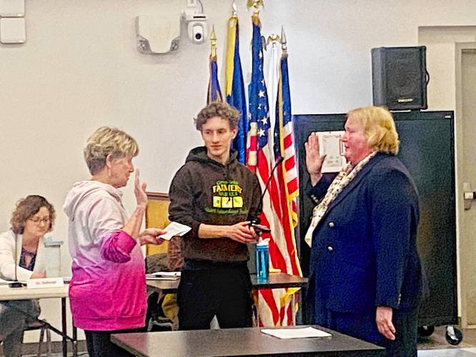Mayor Ginny Desorgher, at left, swears in new Greenfield School Committee member Melodie Goodwin on Wednesday at the John Zon Community Center.