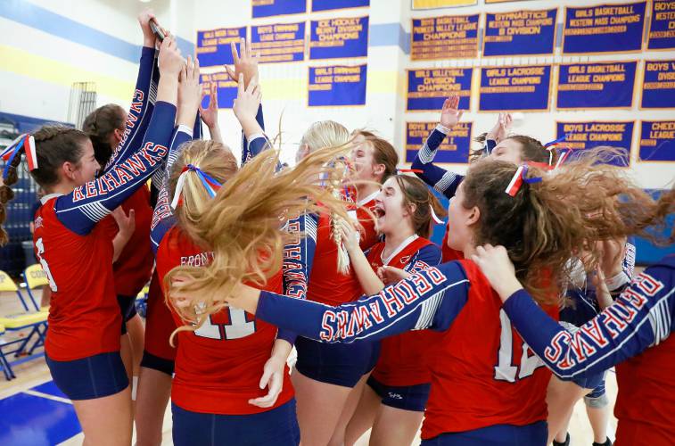 Frontier players celebrate after receiving the Western Massachusetts Class B girls volleyball championship trophy after defeating Baystate Academy on Saturday at Chicopee Comp.