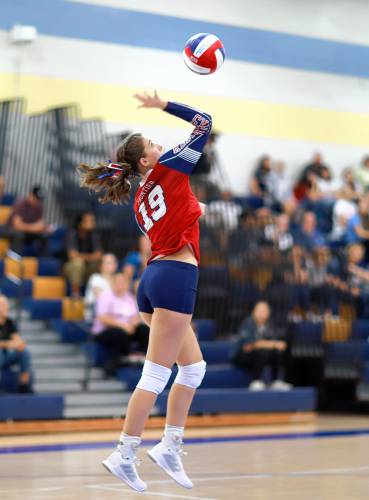 Frontier’s Kate Demaio (19) serves against Baystate Academy in the second set of the Western Mass. Class B girls volleyball final Saturday at Chicopee Comp.