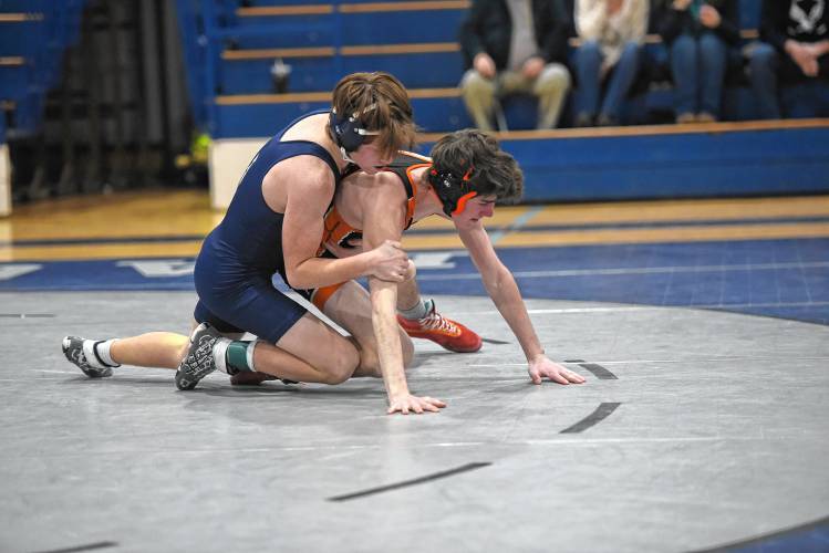 Franklin Tech’s Carsten Couture (left) competes against South Hadley’s PJ Lavelle (right) on Friday in Turners Falls.   