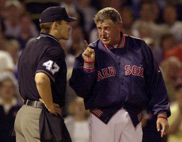 Boston Red Sox manager Jimy Williams, right, continues to argue with home plate umpire Mark Wegner, left, after being ejected during the fifth inning at Fenway Park in Boston on May 10, 2001. 