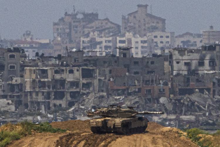 Israeli soldiers on a tank on the border with Gaza Strip in southern Israel on Tuesday.