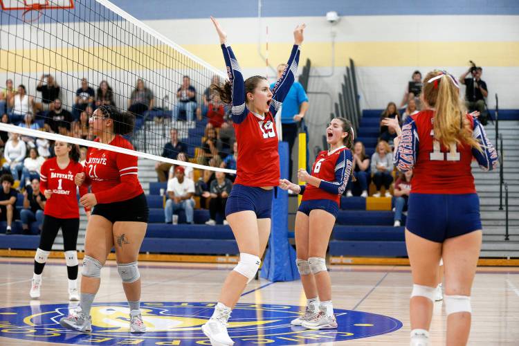 Frontier’s Kate Demaio (19) celebrates a block against Baystate Academy in the first set of the Western Mass. Class B girls volleyball final Saturday at Chicopee Comp.